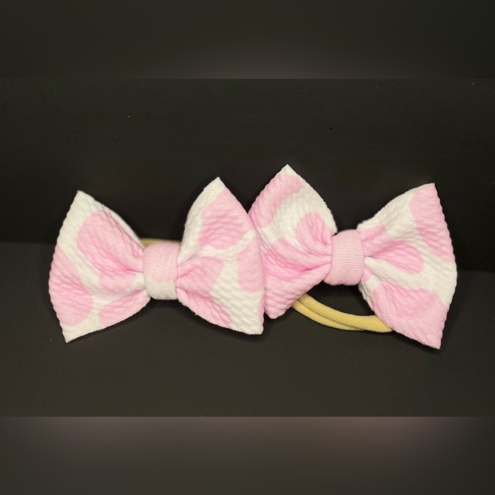 Pink cow print piggies on nylon headband
